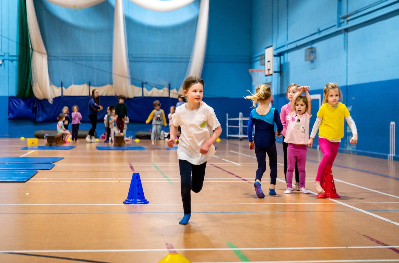 Kids playing in Shine's sports hall